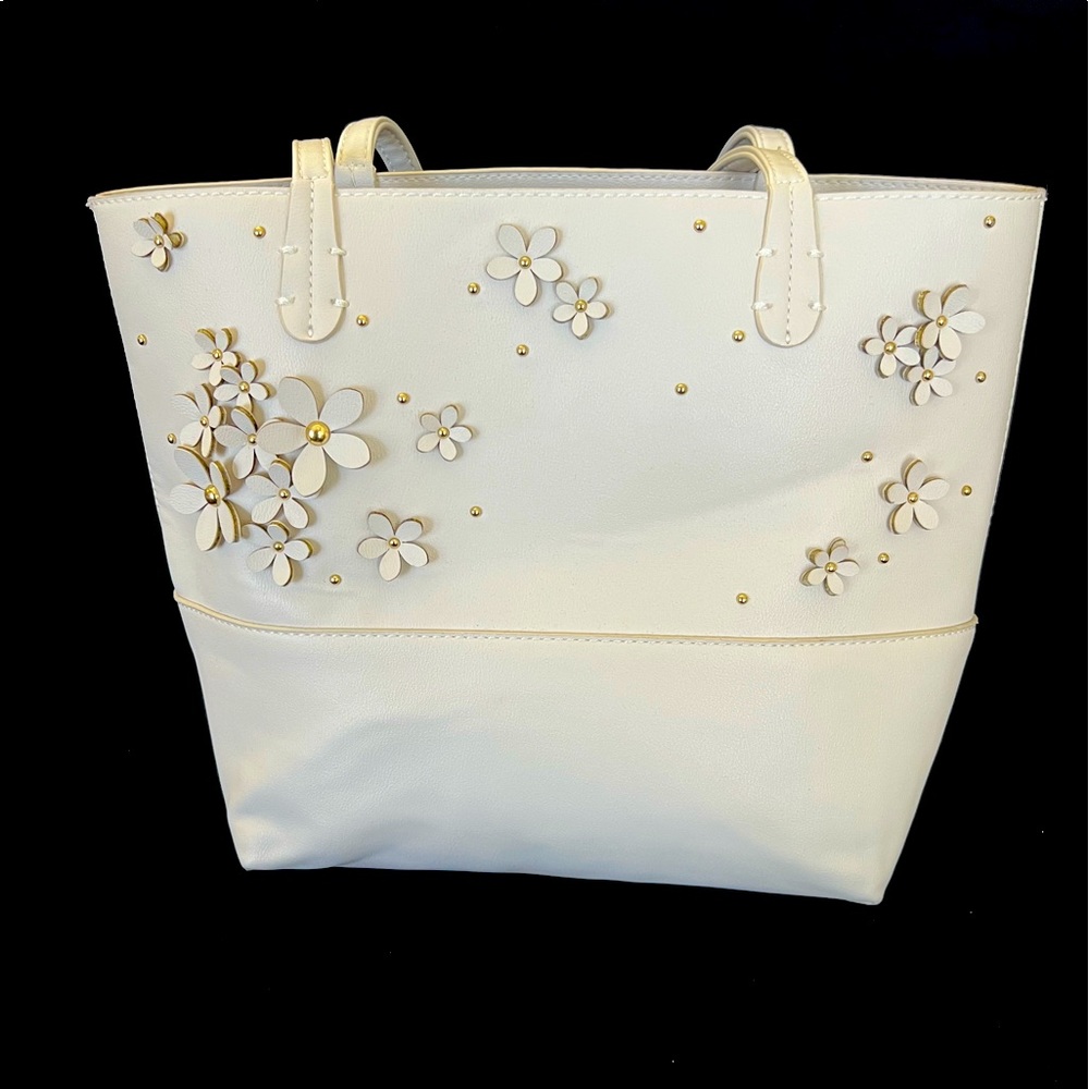 Cream colored small tote bag.